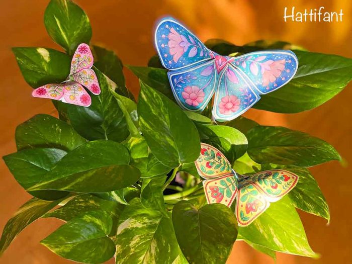 Hattifant's 3D Butterflies with Scandinavian Folk Art Feel on plant